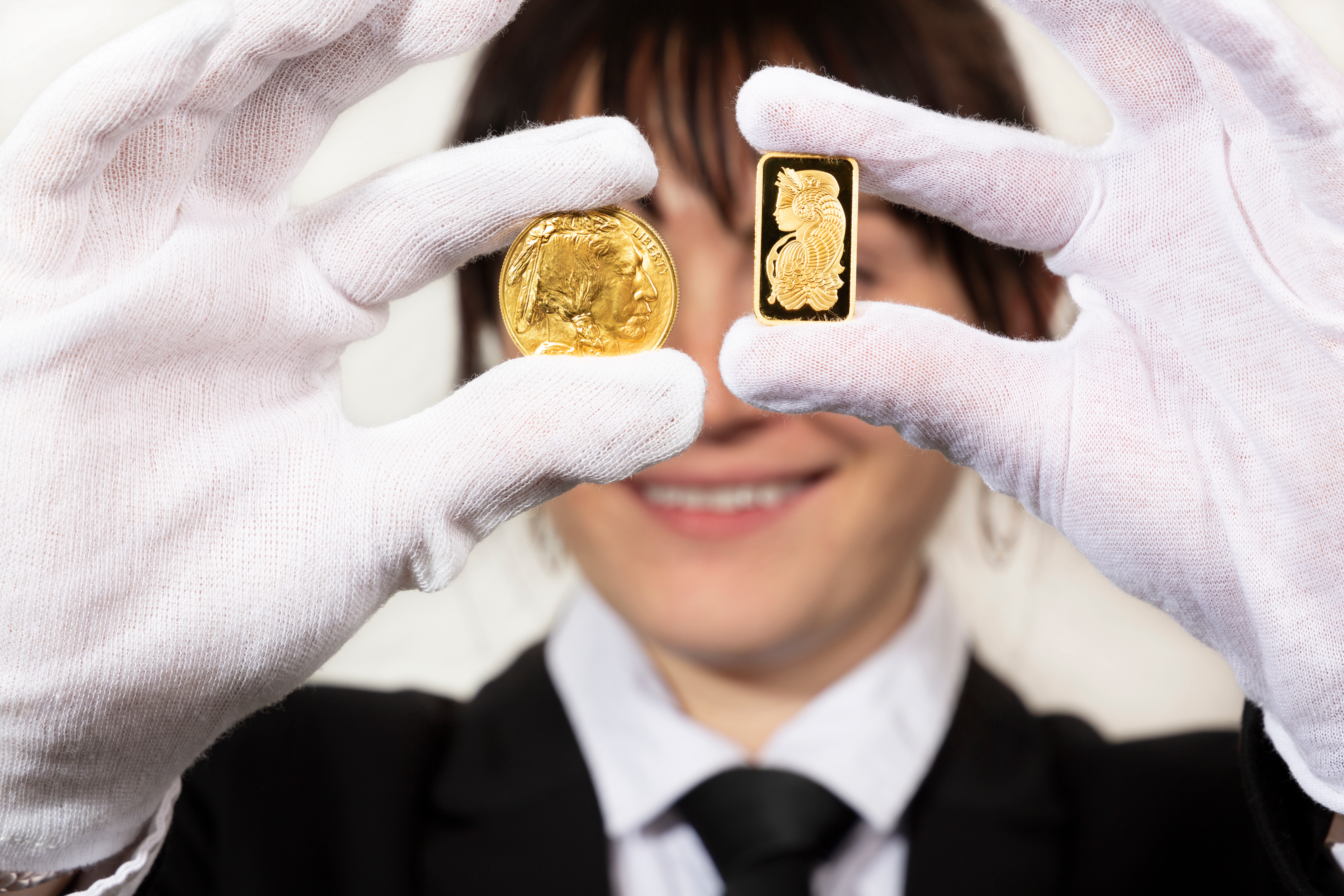 Shiny gold bar and coin for investment